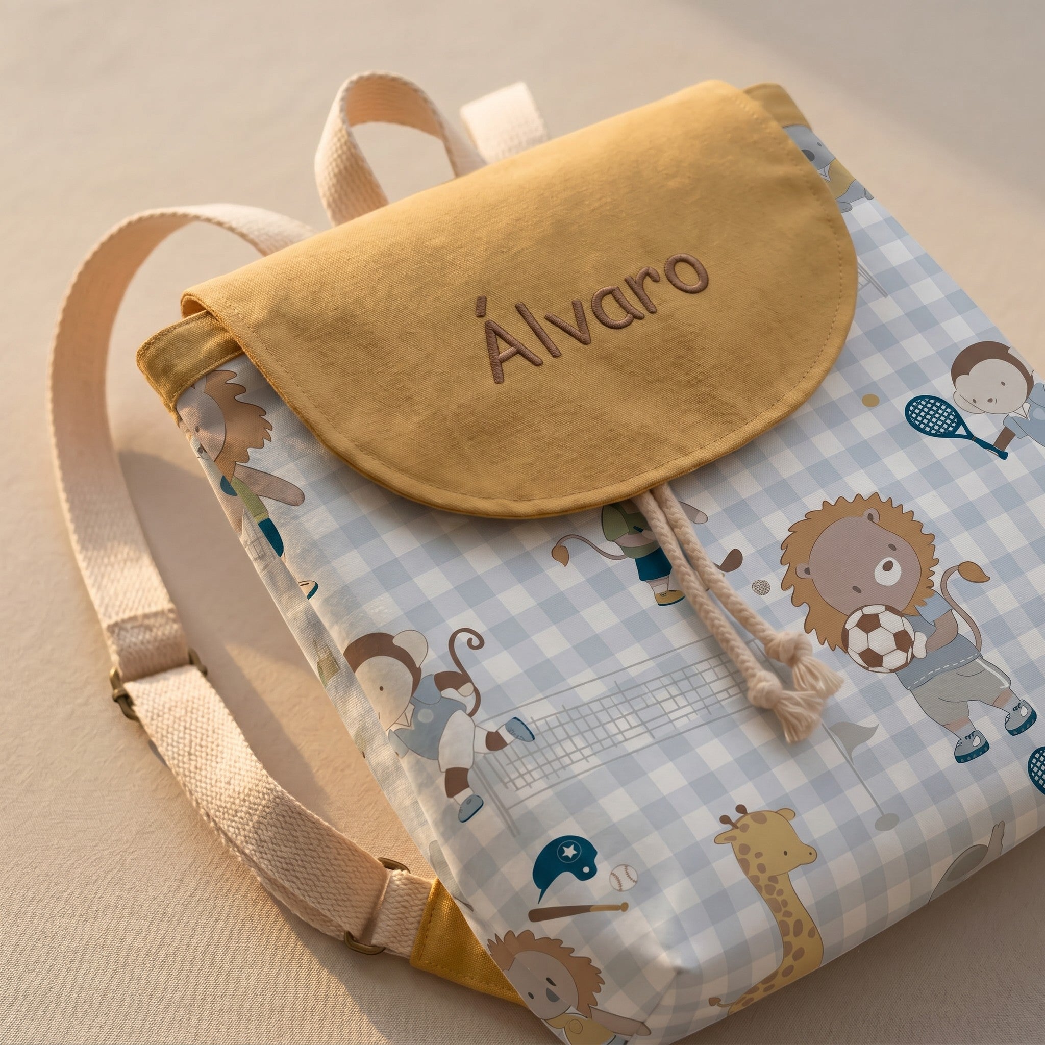 SuYa Shop personalized kids backpack with yellow flap, blue gingham pattern, and cute animal sports illustrations.