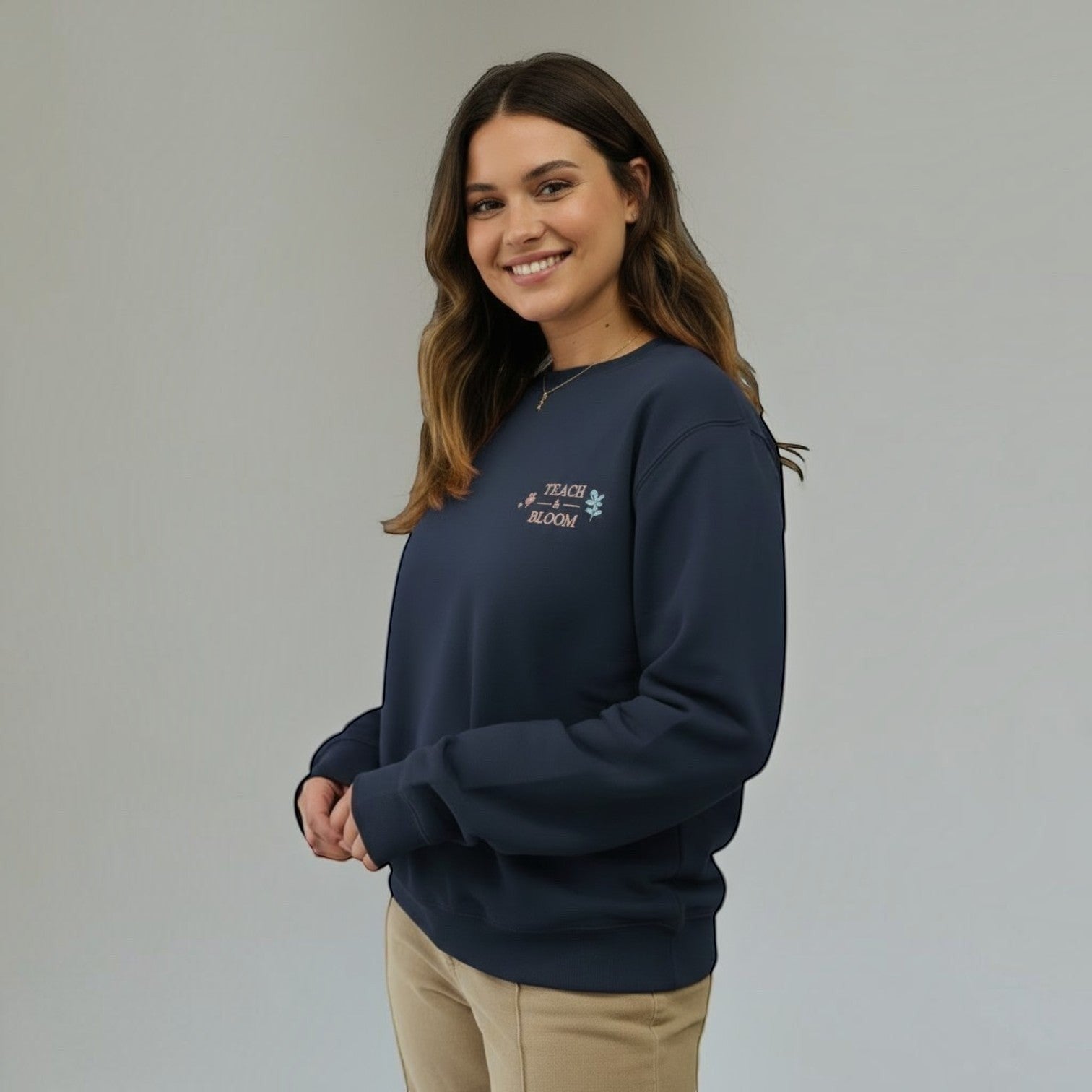 SuYa Shop navy blue cotton blend sweatshirt with Teach and Bloom embroidery worn by a smiling woman