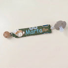 SuYa Shop personalized green fabric pacifier clip featuring a cute monkey design and the name Marta embroidered