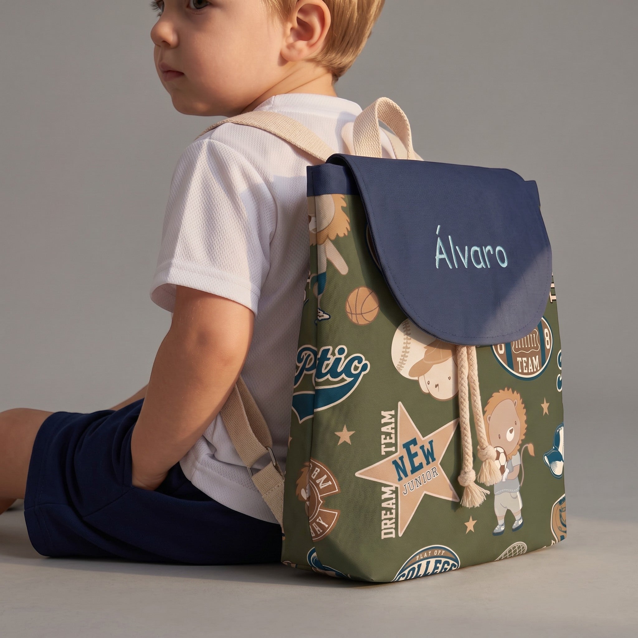 SuYa Shop personalized kids sports backpack in green with sports-themed print and name Alvaro on the navy flap
