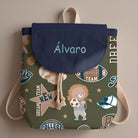 SuYa Shop personalized kids backpack in olive green with sports-themed lion print and navy blue flap with name.