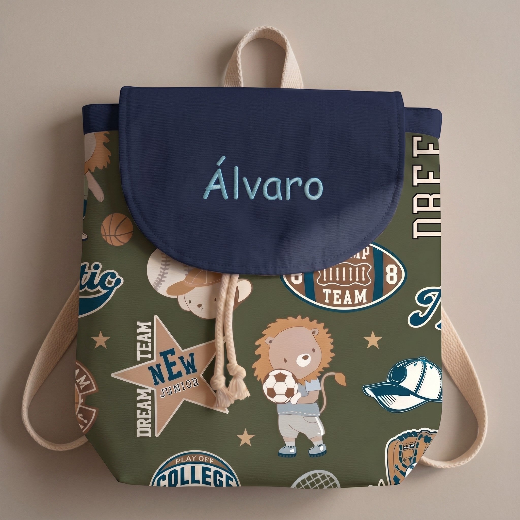 SuYa Shop personalized kids backpack in olive green with sports-themed lion print and navy blue flap with name.