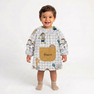 SuYa Shop personalized toddler school smock with animal print, elastic cuffs, and a beige pocket on white background.