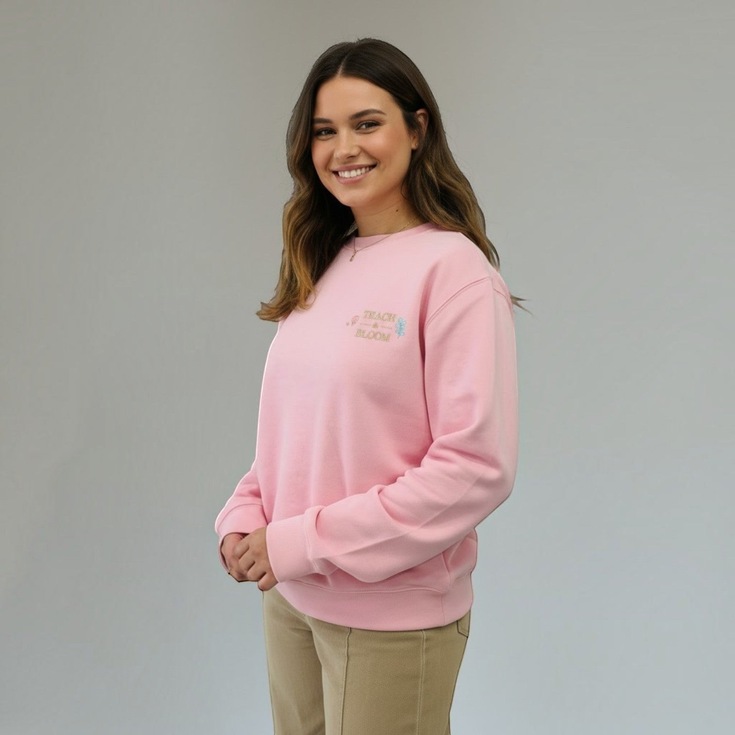 SuYa Shop pink cotton blend sweatshirt with Teach and Bloom embroidery worn by a smiling woman