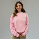 SuYa Shop pink cotton blend sweatshirt with Teach and Bloom embroidery worn by a smiling woman