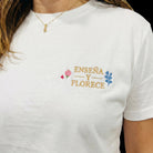 SuYa Shop white cotton t-shirt for teachers with Enseña y Florece embroidered text and floral details